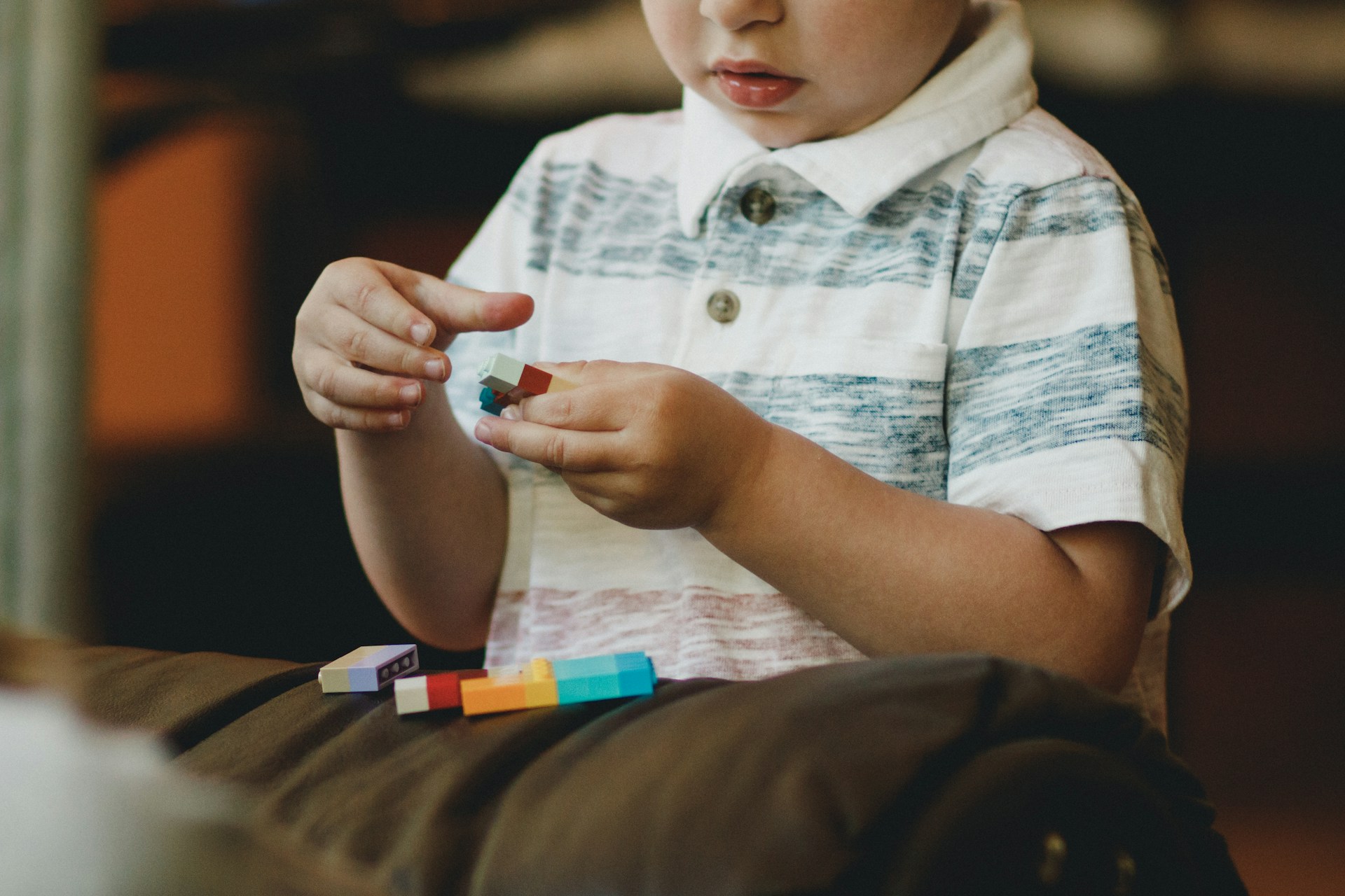 A boy playing with legos